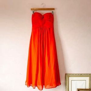 • red strapless pleated bodice formal gown •